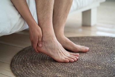 person with gout pain in foot