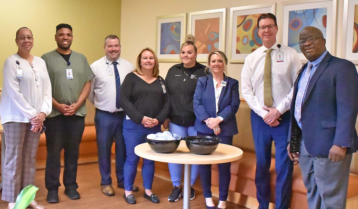 L+M Hospital staff gathered in the new Closer to Home lounge 